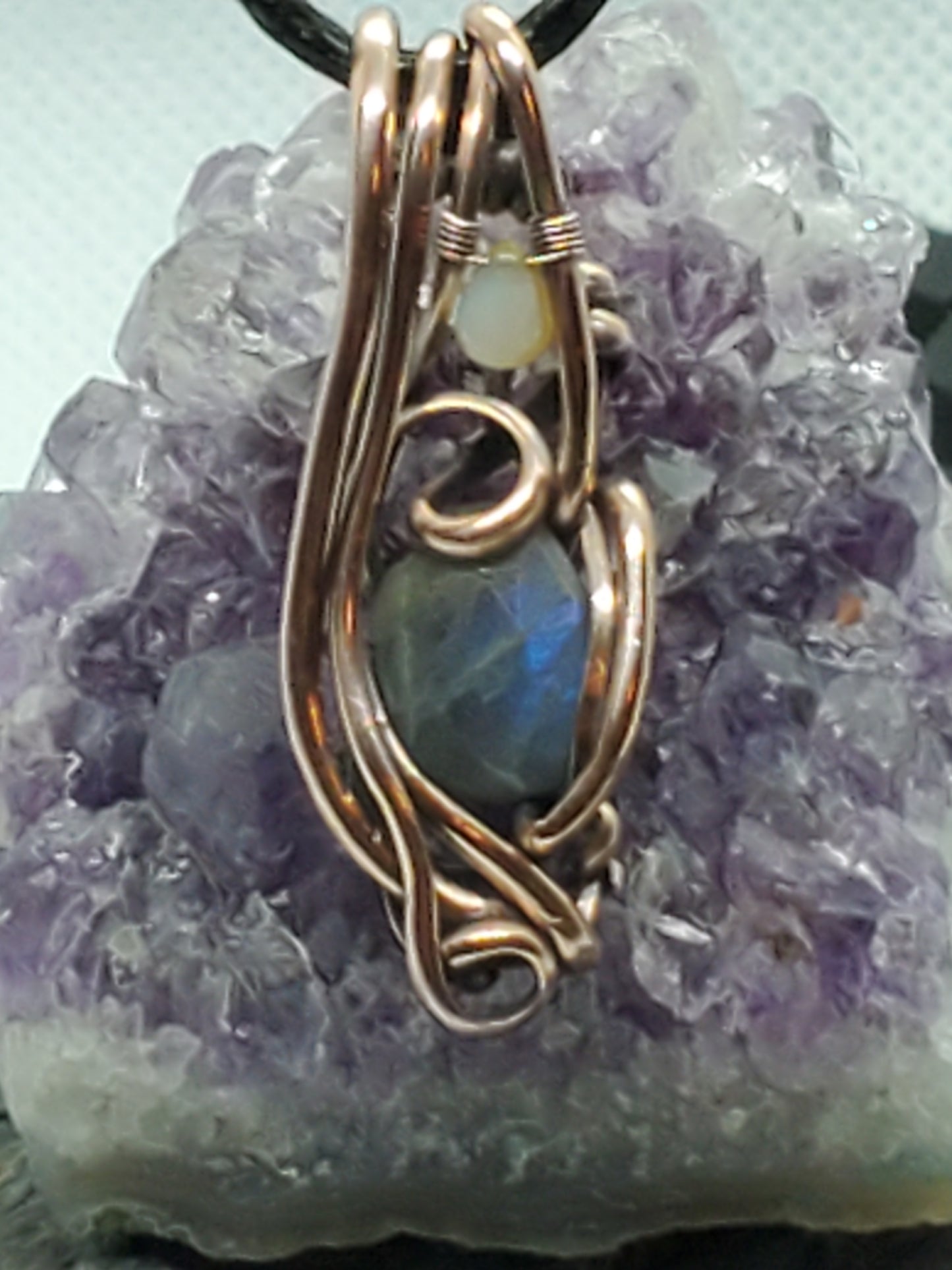 Faceted labradorite with opal teardrop