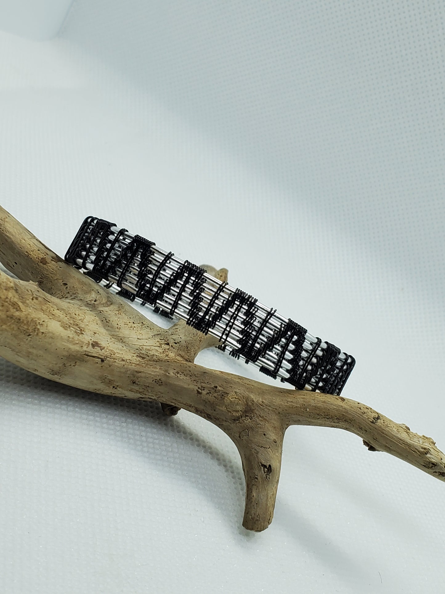Silvertone & black weave bracelet