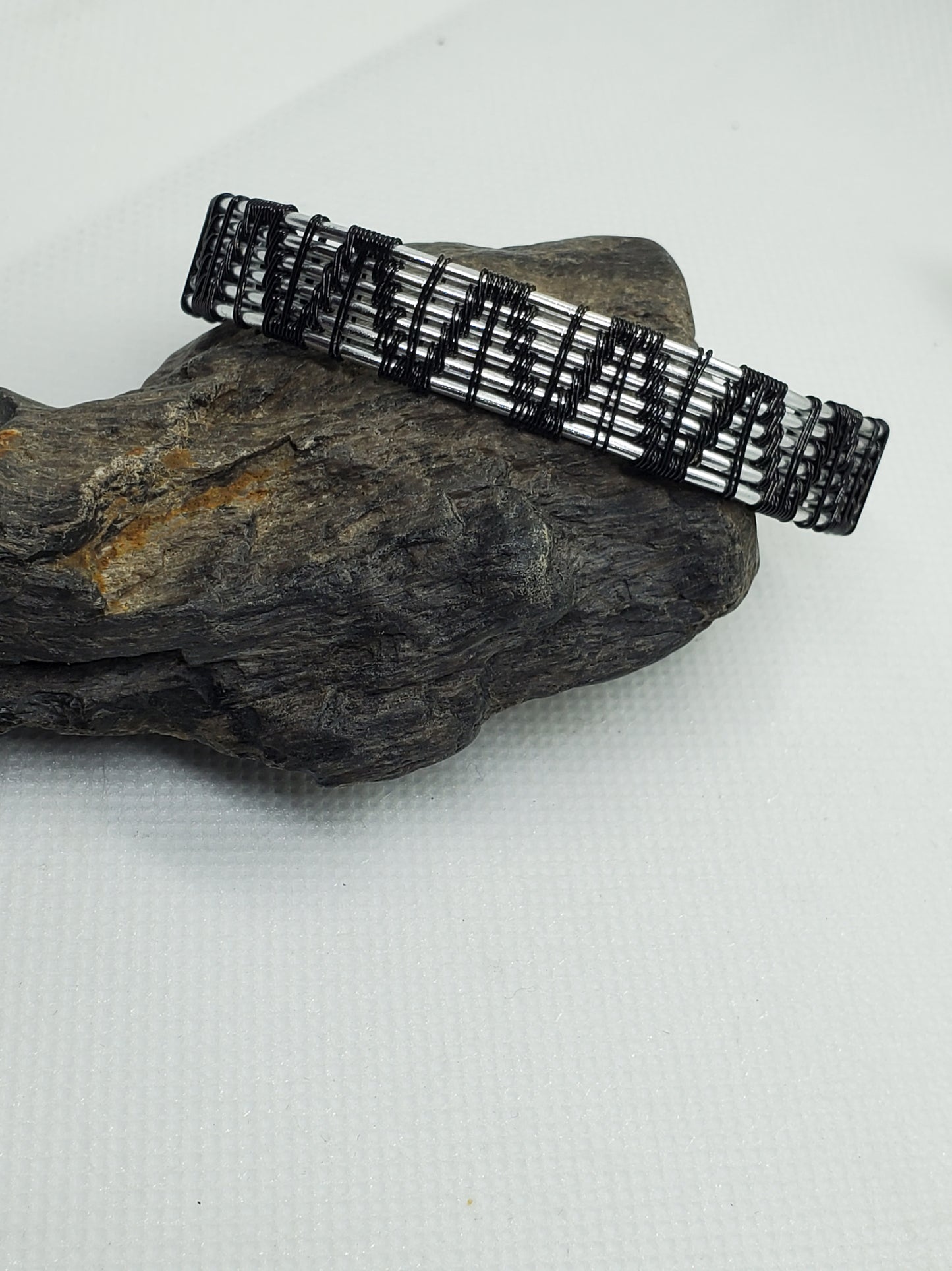 Silvertone & black weave bracelet
