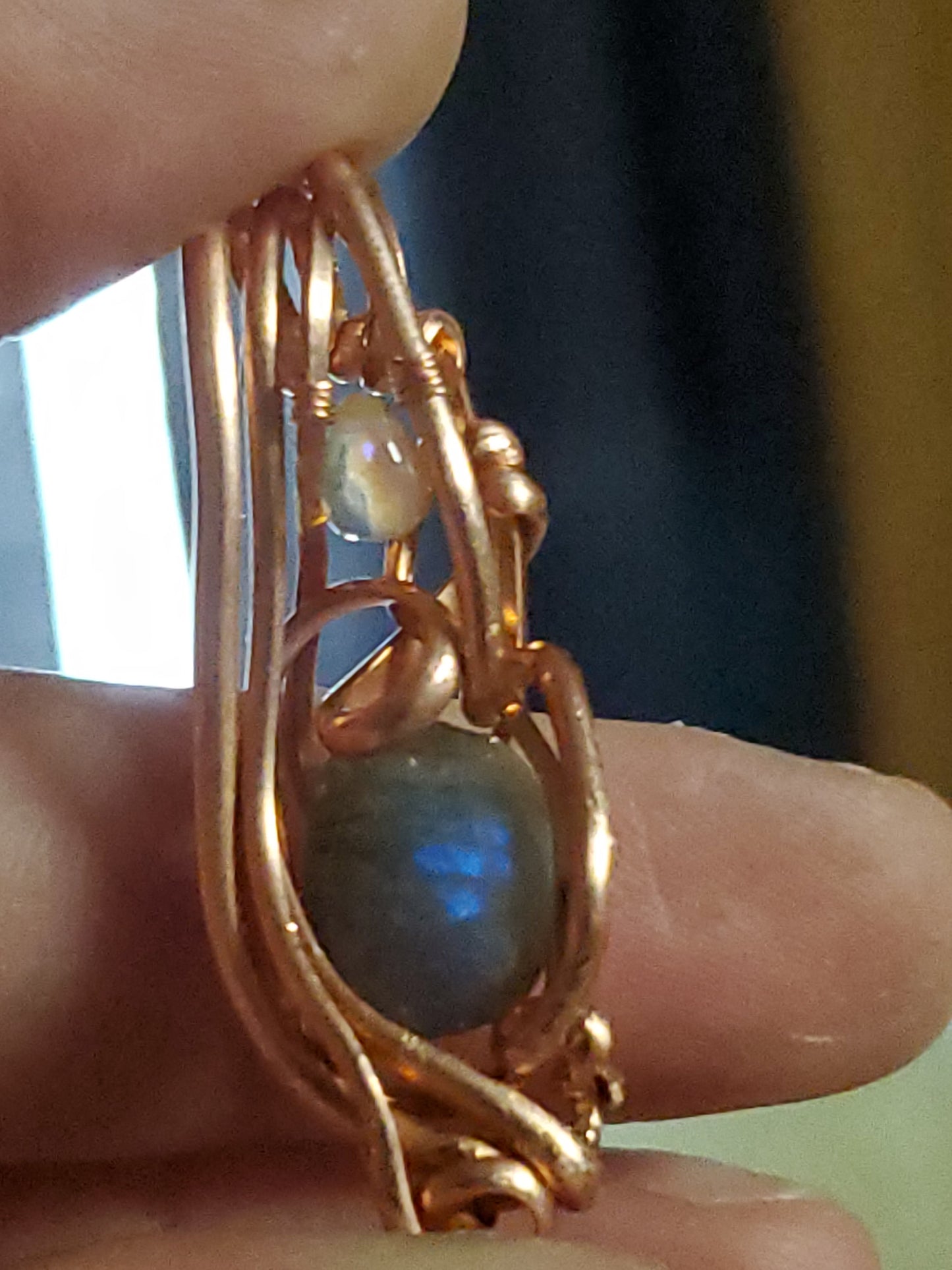 Faceted labradorite with opal teardrop