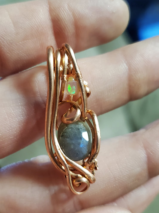 Faceted labradorite with opal teardrop